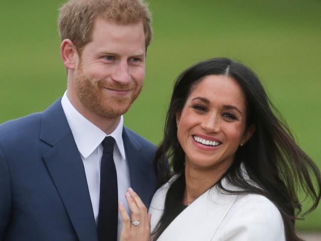 (FILES) In this file photo taken on November 27, 2017 Britain's Prince Harry and his fiancÃ©e US actress Meghan Markle pose for a photograph in the Sunken Garden at Kensington Palace in west London, following the announcement of their engagement. - Prince Harry and Meghan Markle have purchased and moved into a new family home in Santa Barbara, an affluent seaside city outside Los Angeles, according to US media reports. (Photo by Daniel LEAL-OLIVAS / AFP)