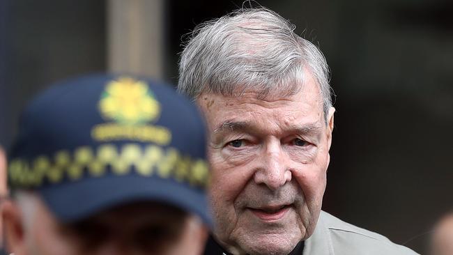 (FILES) In this file photo taken on February 26, 2019, Cardinal George Pell leaves the County Court of Victoria after prosecutors decided not to proceed with a second trial on alleged historical child sexual offences in Melbourne. - Cardinal George Pell is to be sentenced on March 13, 2019, following conviction for child sex crimes. (Photo by CON CHRONIS / AFP)