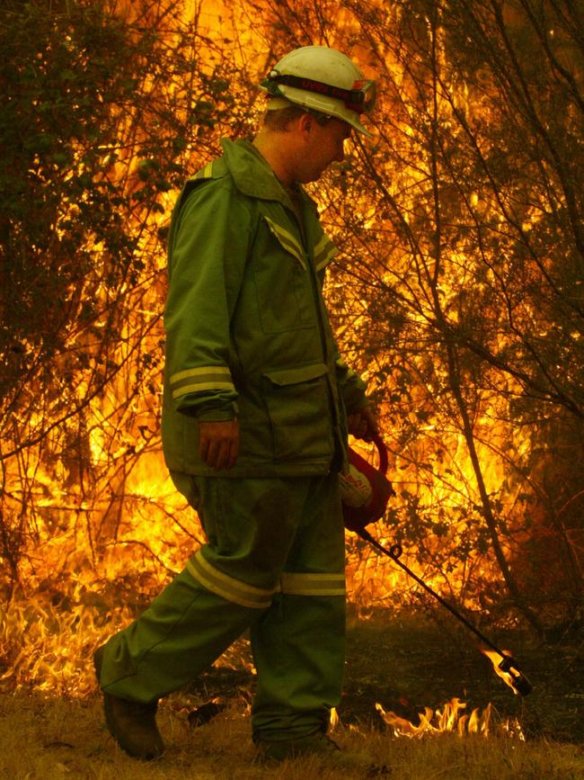 A fireghter monitors a fire in Victoria’s Gippsland, an area identified as being at high risk in the current bushfire season.