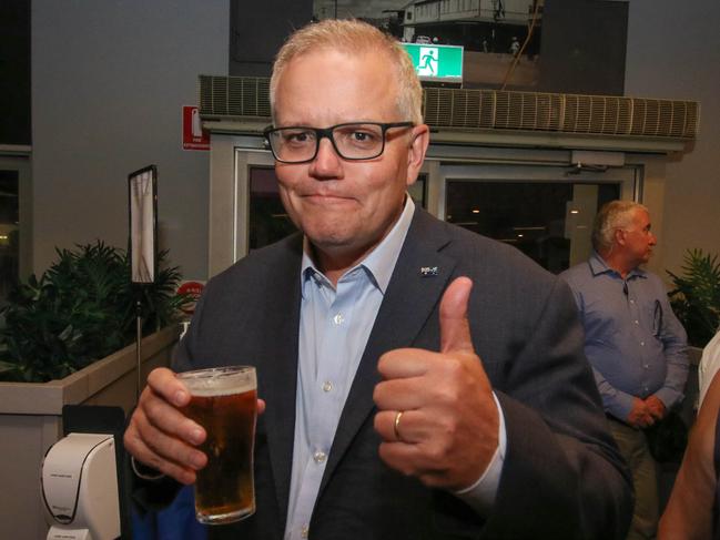 Prime Minister Scott Morrison enjoys a schooner at The Cav during his visit to Darwin last month. Picture: Glenn Campbell