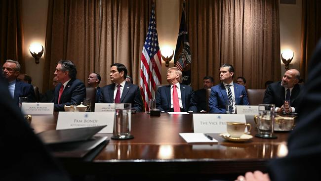 Donald Trump listens during a cabinet meeting at the White House in Washington.