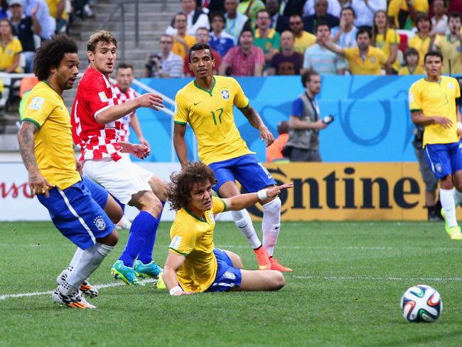 Brazil’s Marcelo watches on in horror as his own goal gives Croatia an early lead in the 2014 FIFA World Cup opening match.