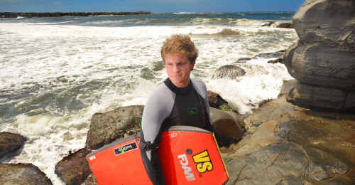 Dean Everson of Yamba prepares to head back into the surf where he was attacked by what he thinks was a white-pointer shark at Turners Beach. Picture: Adam Hourigan