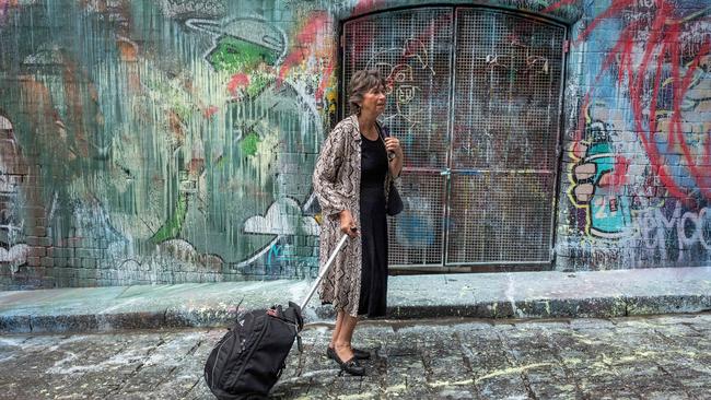 A passer-by inspects the damage. Picture: Jake Nowakowski