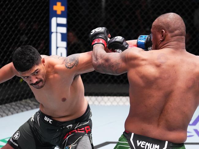 Junior Tafa (L) lands a big left hand on Mohammed Usman (R). Picture: Chris Unger/Zuffa LLC/Getty Images