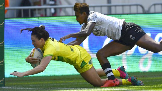 Young Australian sevens player Jakiya Whitfield scoring during her debut World Series event.