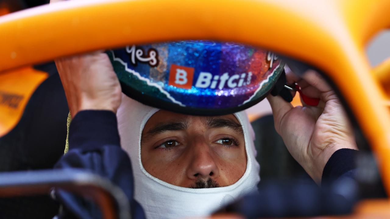 ABU DHABI, UNITED ARAB EMIRATES - DECEMBER 14: Daniel Ricciardo of Australia and McLaren F1 prepares to drive in the garage during Formula 1 testing at Yas Marina Circuit on December 14, 2021 in Abu Dhabi, United Arab Emirates. (Photo by Clive Rose/Getty Images)