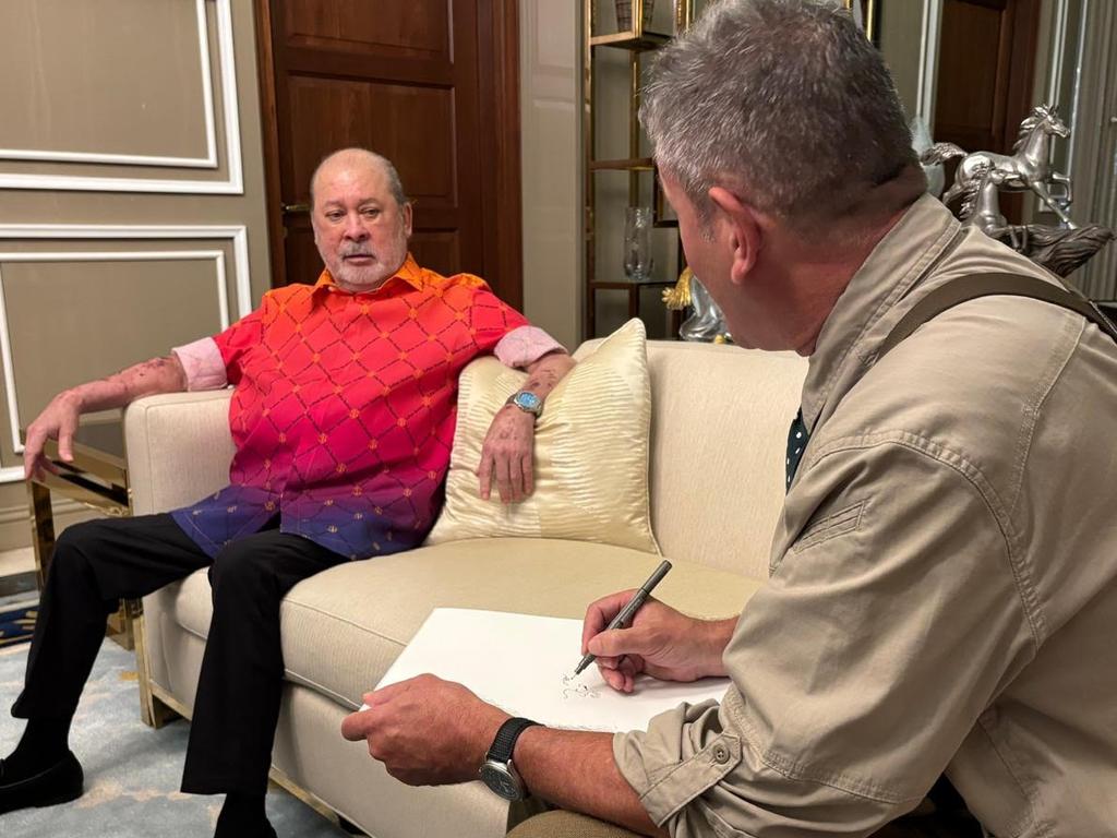 Cartoonist Warren Brown sketching the King of Malaysia, Sultan Ibrahim Iskander of Johore, at his home before the Bean Team were given a tour of his personal car collection.