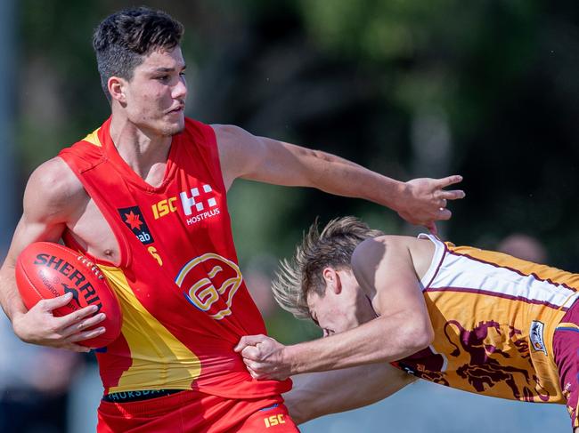 Ned Stevens fends off a tackle while playing for the Suns Academy.