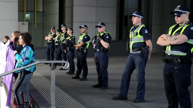 A strong police presence at the scene. Picture: Andrew Henshaw