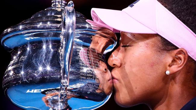 Naomi Osaka of Japan kisses the Daphne Akhurst Memorial Cup following victory in her Women's Singles Final match against Petra Kvitova