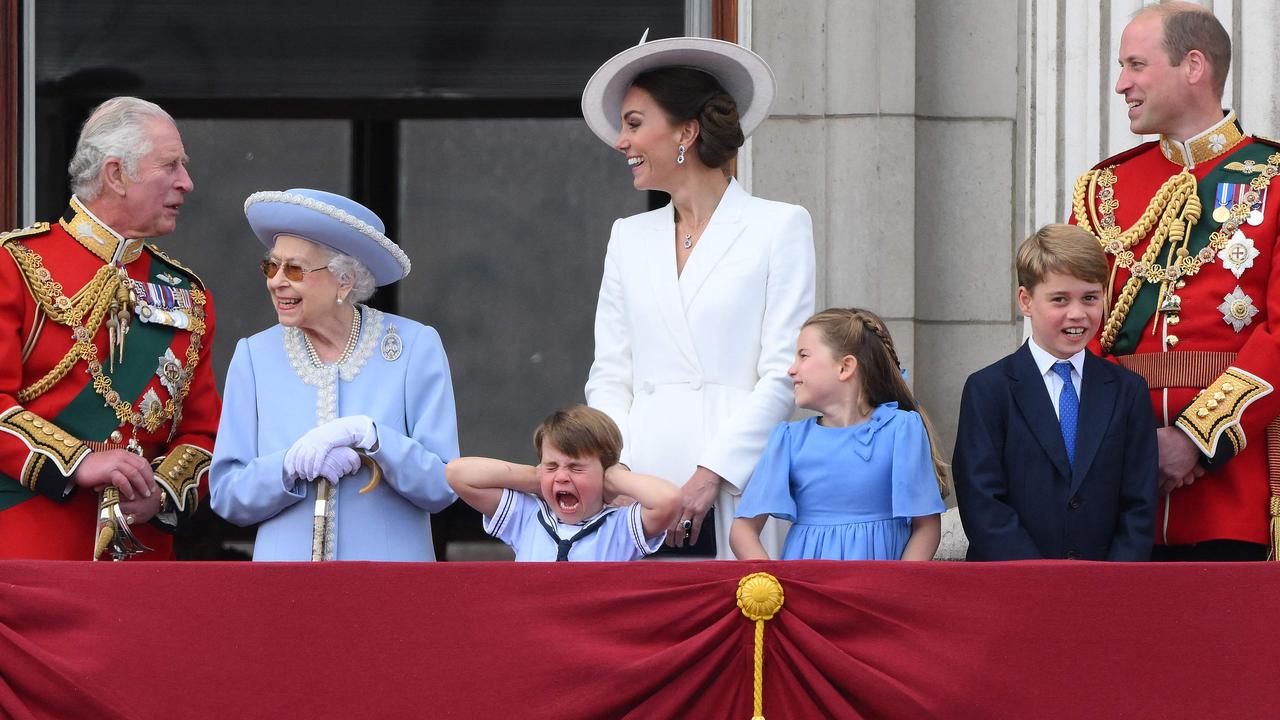 Britain's Prince Louis of Cambridge (C) holds his ears during a special fly-past from Buckingham Palace. Picture: Daniel LEAL / AFP