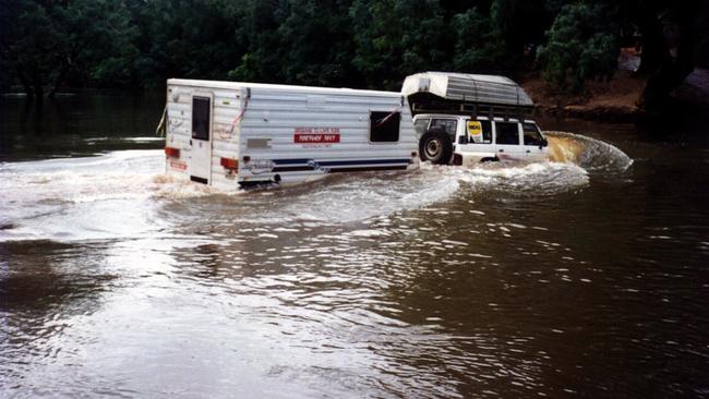 File photo: Adventurer Frank Thompson tows caravan across flooded Wenlock River in 1997.