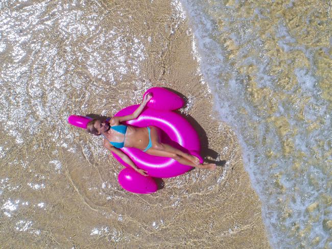 Leticia Boyce, 24 from Coolangatta makes the most of the sunshine at Tallebudgera Creek. Picture: NIGEL HALLETT