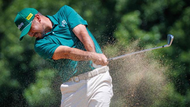 Jason Day plays a bunker during the second round of the Australian PGA Championship. Picture: Patrick HAMILTON / AFP