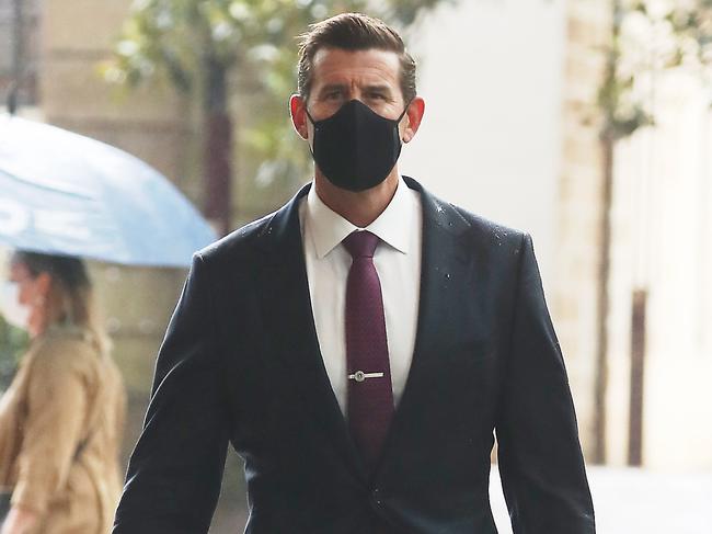 Daily Telegraph February 2/22 . Ben Robert Smith arrives at the Supreme Court alone today .picture John Grainger