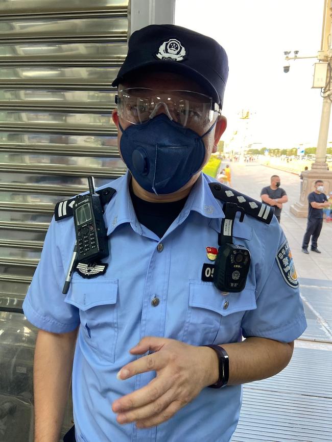 Alan, the head of the "International division" of Beijing's Tiananmen Square district police, explaining that journalists are not allowed to enter the park. Picture: Will Glasgow