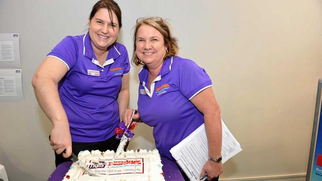 Amanda Dollery and Toni Garrett cut the cake for the opening of BUSHkids Early Childhood Early Intervention service centre in Gladstone. Picture: Mike Richards GLA260718KIDS