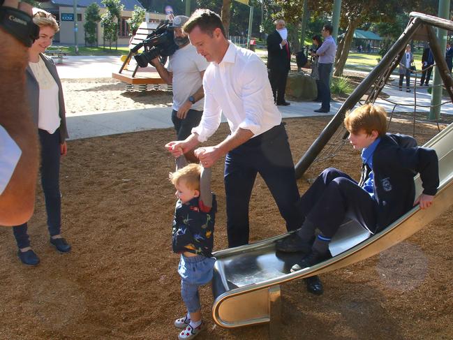 Then leadership hopeful Chris Minns helps sons George (left) and Nick as they play after a press conference in 2019. Picture: AAP Image/David Gray