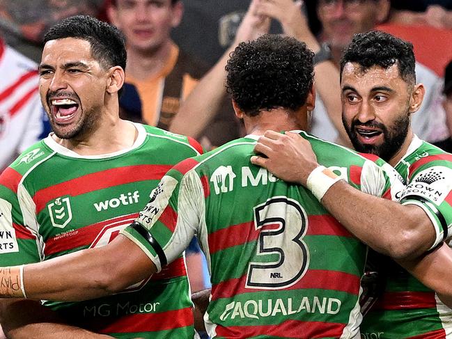 BRISBANE, AUSTRALIA - MAY 06: Alex Johnston of the Rabbitohs celebrates with team mates Cody Walker and Isaiah Tass of the Rabbitohs after scoring a try during the round 10 NRL match between Melbourne Storm and South Sydney Rabbitohs at Suncorp Stadium on May 06, 2023 in Brisbane, Australia. (Photo by Bradley Kanaris/Getty Images)