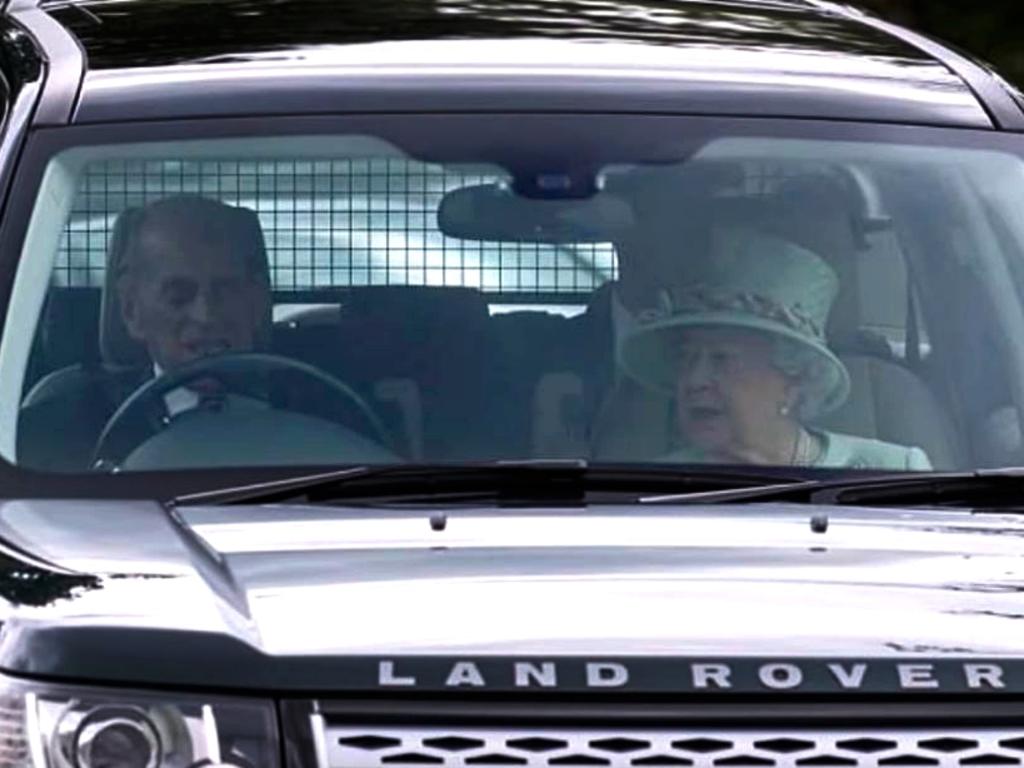 Prince Philip driving Queen Elizabeth in his Land Rover in 2017.