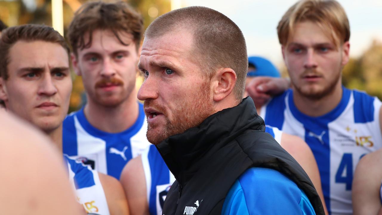 MELBOURNE, AUSTRALIA - MAY 29: Leigh Adams, Coach of the Kangaroos speaks to players during the round 10 VFL match between Sandringham and the North Melbourne Kangaroos at Trevor Barker Beach Oval on May 29, 2022 in Melbourne, Australia. (Photo by Kelly Defina/AFL Photos/via Getty Images )
