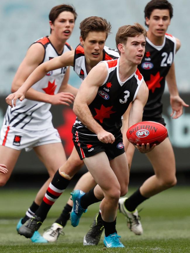 Taj Schofield gets a handball away in the NAB League All Stars match, a curtain-raiser to the 2019 grand final. Picture: Darrian Traynor/AFL Photos/Getty Images