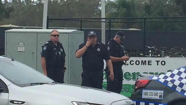 Police outside Helensvale State School during the lockdown.