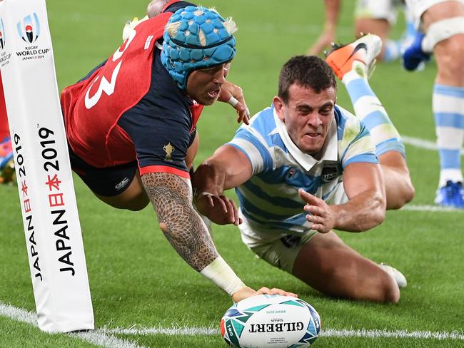 England winger Jack Nowell dives over to score against Argentina. Picture: AFP