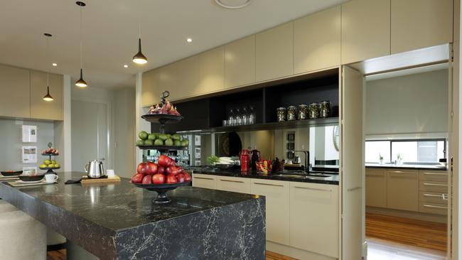 Butler’s pantry and prep kitchen. can be seen behind the main kitchen area.