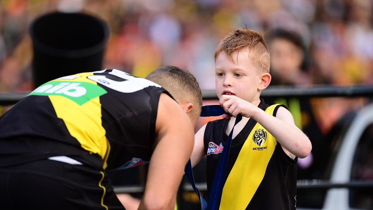 Shai Bolton receives his 2019 premiership medal. Picture: AFL Photos