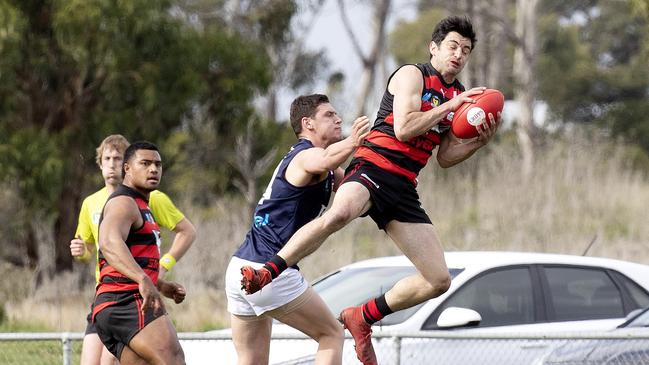 Lauderdale’s Alex Hevey marks during the game against Launceston at Lauderdale last month. Picture Chris Kidd