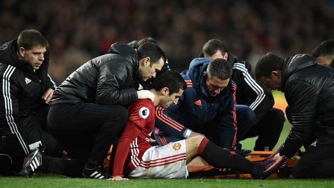 Mkhitaryan receives medical attention.