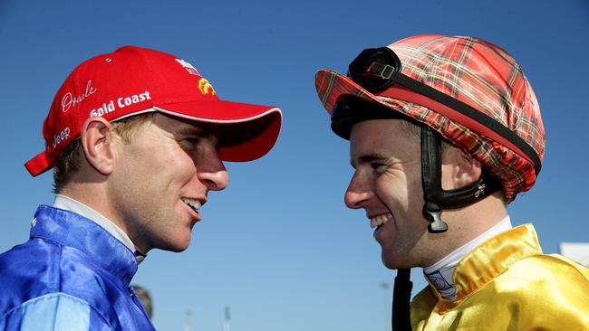 (L — R) Nathan Berry shares a laugh with Tommy after riding Unencumbered to victory in the 2014 Magic Millions 2YO Classic. Picture: Adam Head