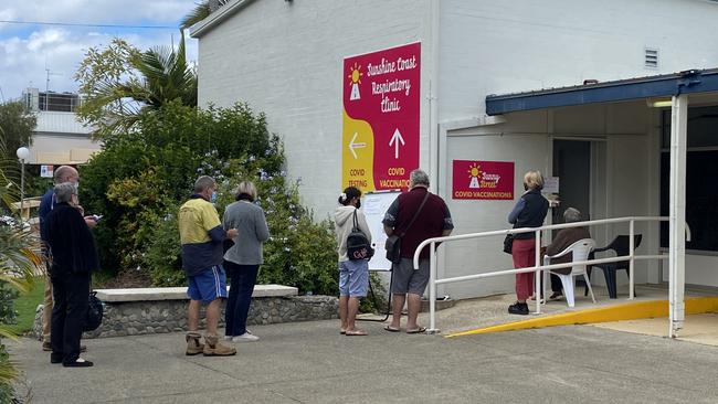 A queue forms at the Sunny Street Covid vaccine and testing hub in Tewantin shortly after the Premier announced a three day lockdown. Picture: Maddie Manwaring