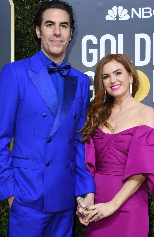 Sacha Baron Cohen and his Aussie actress wife Isla Fisher take the Golden Globes red carpet. Picture: AFP.