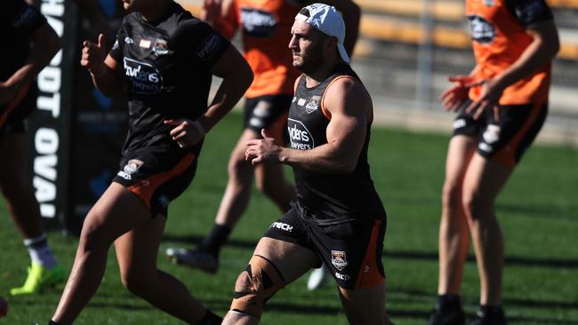 Farah trained with his leg heavily strapped. Picture by Brett Costello.