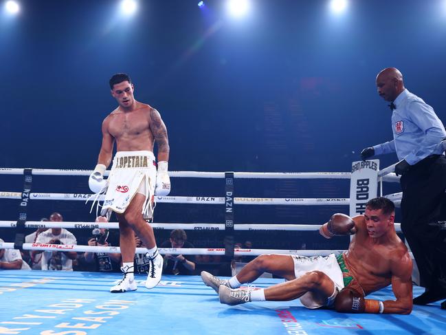 GOLD COAST, AUSTRALIA - JANUARY 08: Jai Opetaia knocks down David Nyika during the IBF And Ring Magazine Cruiserweight World Title Fight between Jai Opetaia and David Nyika at the Gold Coast Convention Centre on January 08, 2025 in Gold Coast, Australia. (Photo by Chris Hyde/Getty Images)