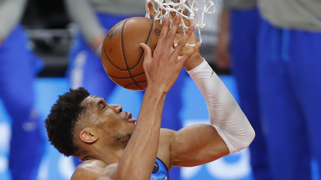 ATLANTA, GEORGIA - JUNE 27: Giannis Antetokounmpo #34 of the Milwaukee Bucks makes a basket against the Atlanta Hawks during the second half in game three of the Eastern Conference Finals at State Farm Arena on June 27, 2021 in Atlanta, Georgia. NOTE TO USER: User expressly acknowledges and agrees that, by downloading and or using this photograph, User is consenting to the terms and conditions of the Getty Images License Agreement. Todd Kirkland/Getty Images/AFP == FOR NEWSPAPERS, INTERNET, TELCOS &amp; TELEVISION USE ONLY ==