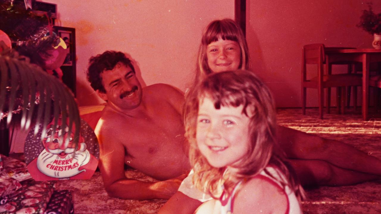 Graham Childs with daughters Rachelle (background) and Kristy (foreground) one Christmas morning.