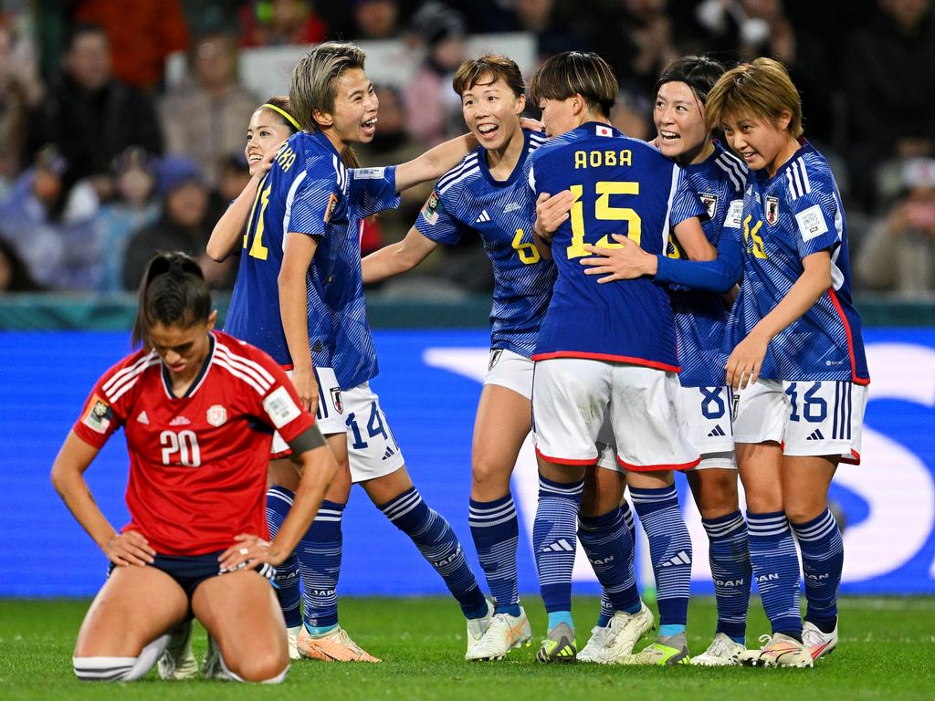 Joy and despair: Aoba Fujino of Japan celebrates with teammates after scoring her team's second goal against Costa Rica in Dunedin. Picture: Joe Allison/Getty Images