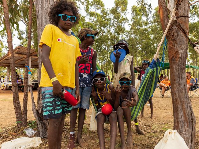 Yolngu children sit in a hammock during the Garma Festival at Gulkula on July 31, 2022 in East Arnhem, Australia. The annual Garma festival is held at Gulkula, a significant ceremonial site for the Yolngu people of northeast Arnhem Land about 40km from Nhulunbuy on the Gove peninsula in East Arnhem. (Photo by Tamati Smith/Getty Images)