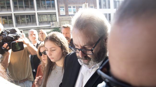 Brett Button arrives at Newcastle court last week surrounded with family and friends. Picture: NCA NewsWire / Jeremy Piper