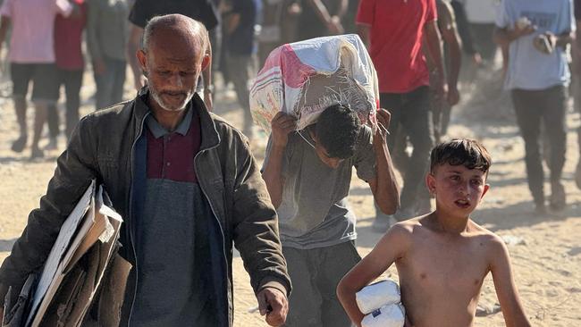 Palestinians receive food packages from the Gaza Humanitarian Fund. Picture: AFP