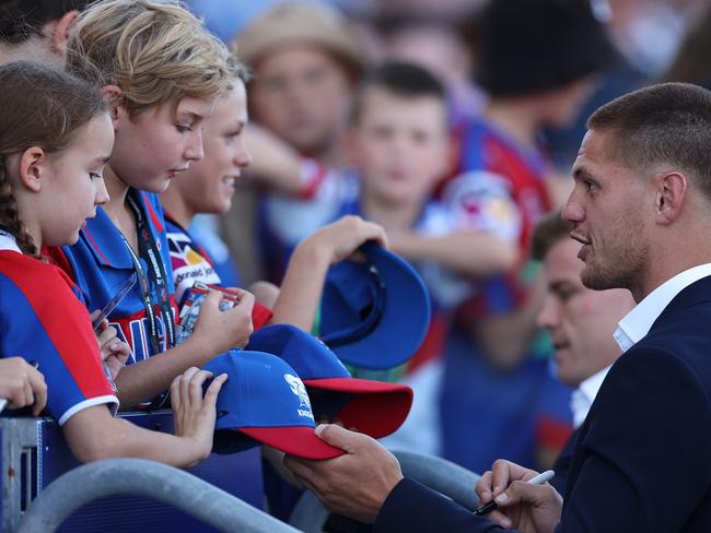 Kalyn Ponga signs autographs for Knights fans before the round three match against the Dolphins at McDonald Jones Stadium. Picture: Getty Images