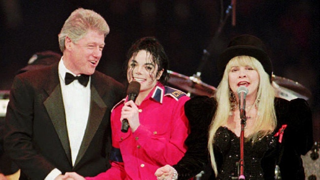 US President Bill Clinton with Michael Jackson and Stevie Nicks sings during inauguration festivities in Landover, Maryland in 1993. Picture: AFP