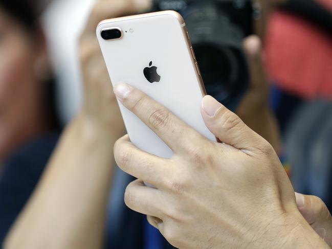 The new iPhone 8 Plus is displayed in the showroom after the new product announcement at the Steve Jobs Theater on the new Apple campus on Tuesday, Sept. 12, 2017, in Cupertino, Calif. (AP Photo/Marcio Jose Sanchez)