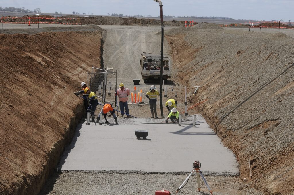 Brisbane West Wellcamp Ariport First concrete is poured for the foundations of the new Wellcamp Airport terminal, due for completion in September 2014. Photo: Bev Lacey / The Chronicle. Picture: Bev Lacey