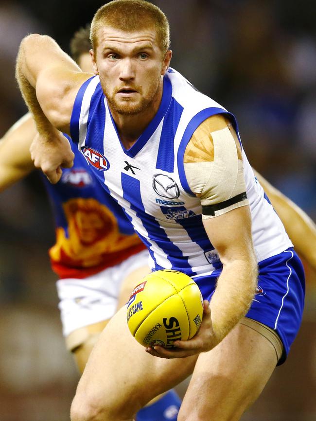 Leigh Adams looks to fire off a handball during his days at North Melbourne. Picture: Michael Klein.