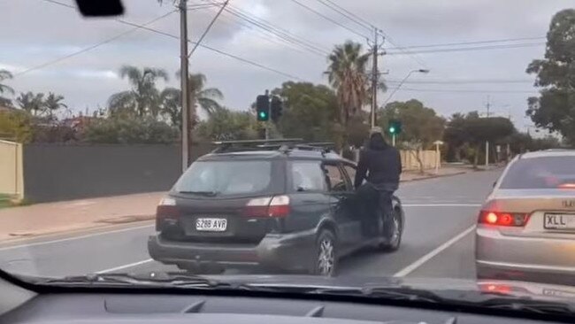 The video shows the man driving while sitting on his car door. Picture: justadelaidethings/@eyad_ghosn01